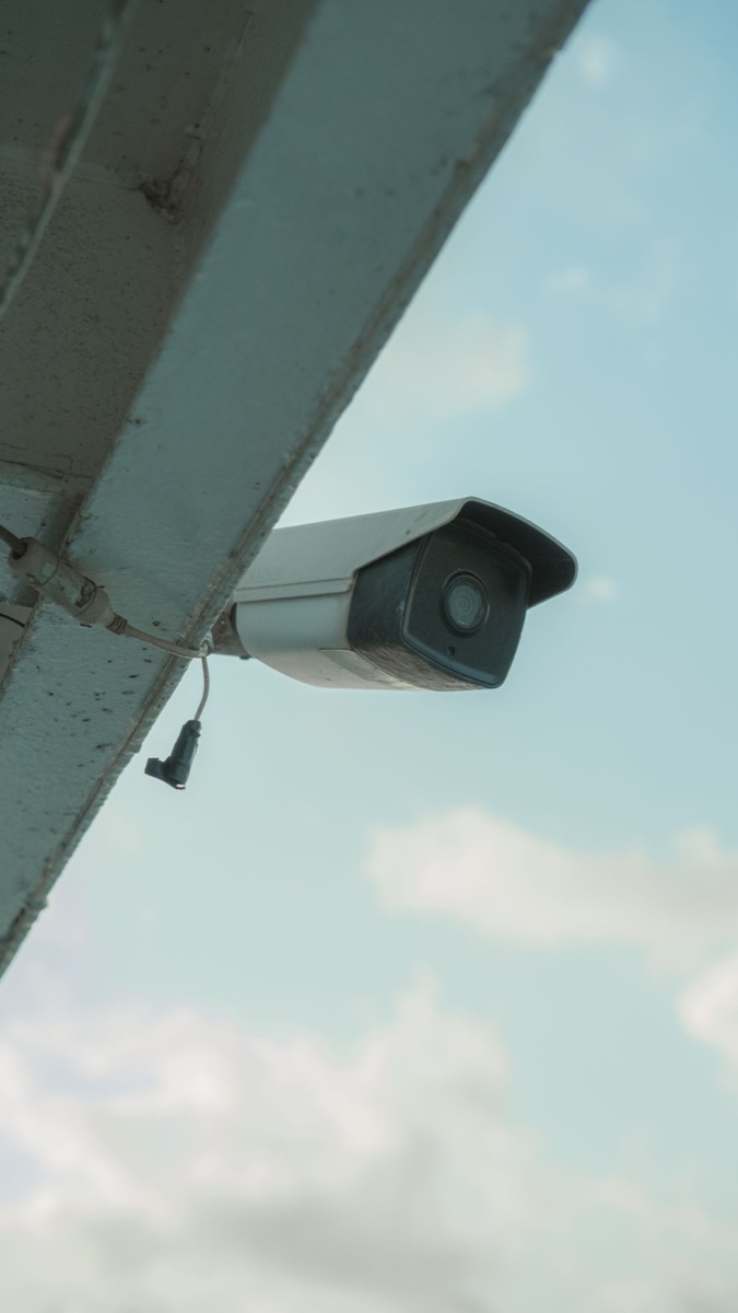 Bullet CCTV camera installed under a building eave